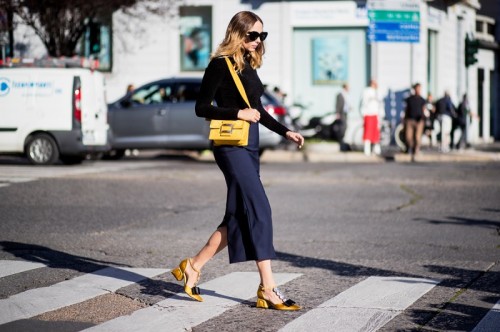 milan-fashion-week-street-style-spring-2018-Candela-novembre-black-sweater-navy-skirt-yellow-bag-shoes.jpg