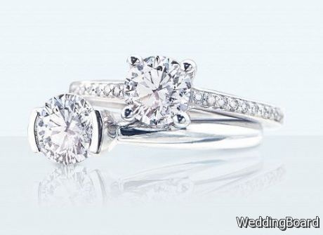 Two plain wedding rings with solitaire